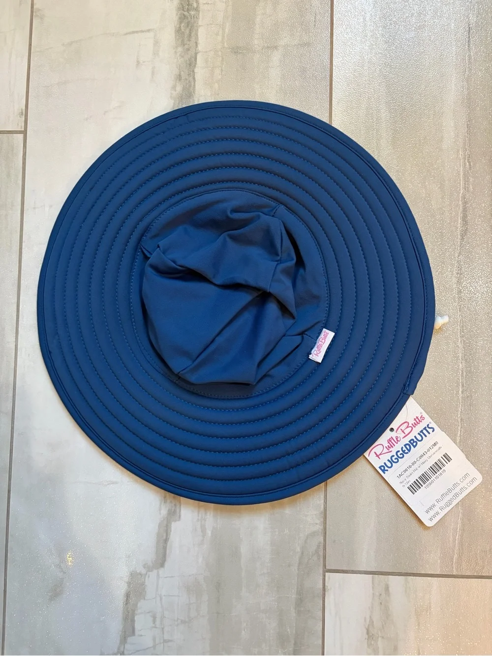 NWT RuffleButts Infant Navy Wide Brim Sun & Swim Hat with Chin Tie, 0-12 months